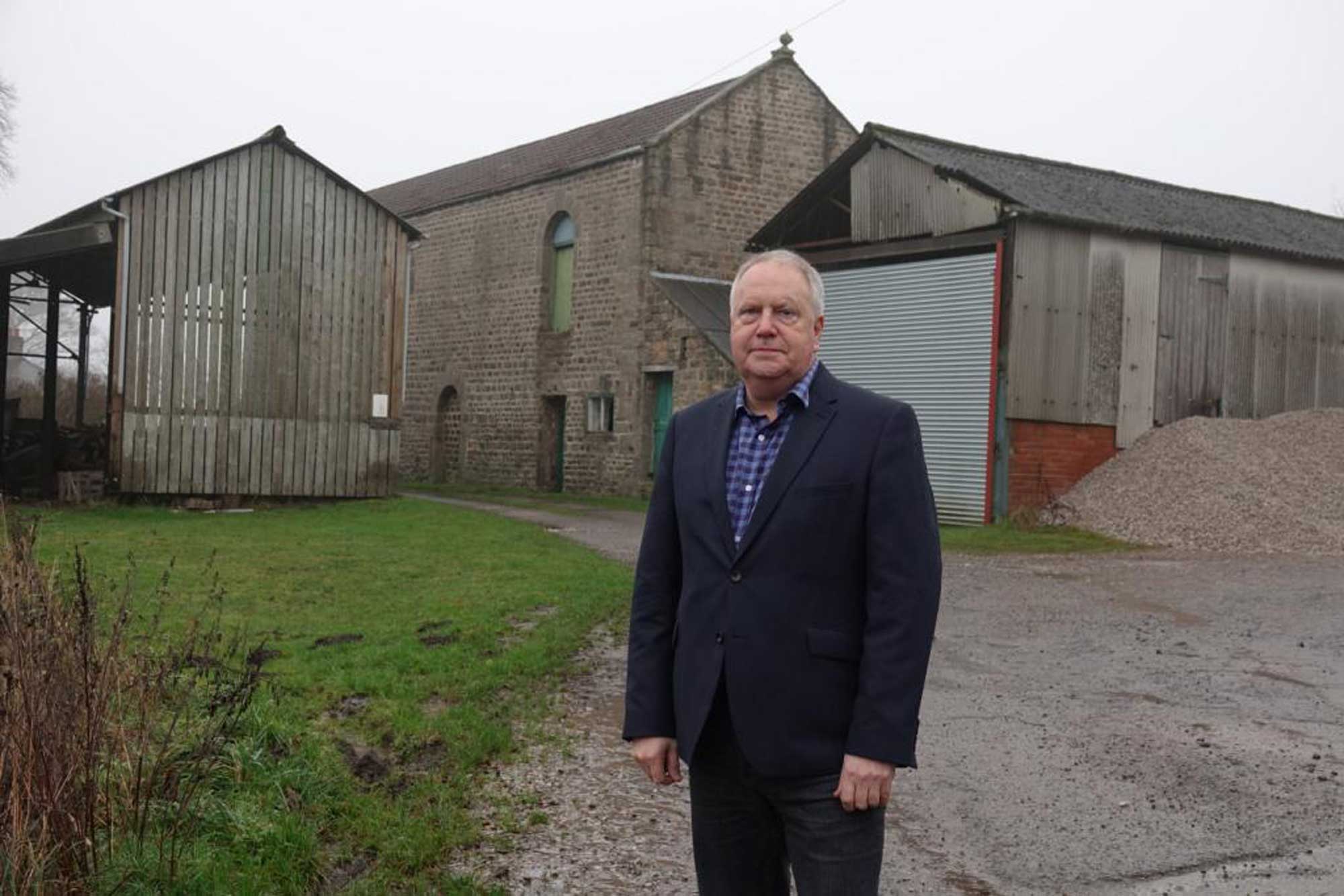 Crimple Valley campaigner Steve Norman in front of the barn at Crimple House Farm