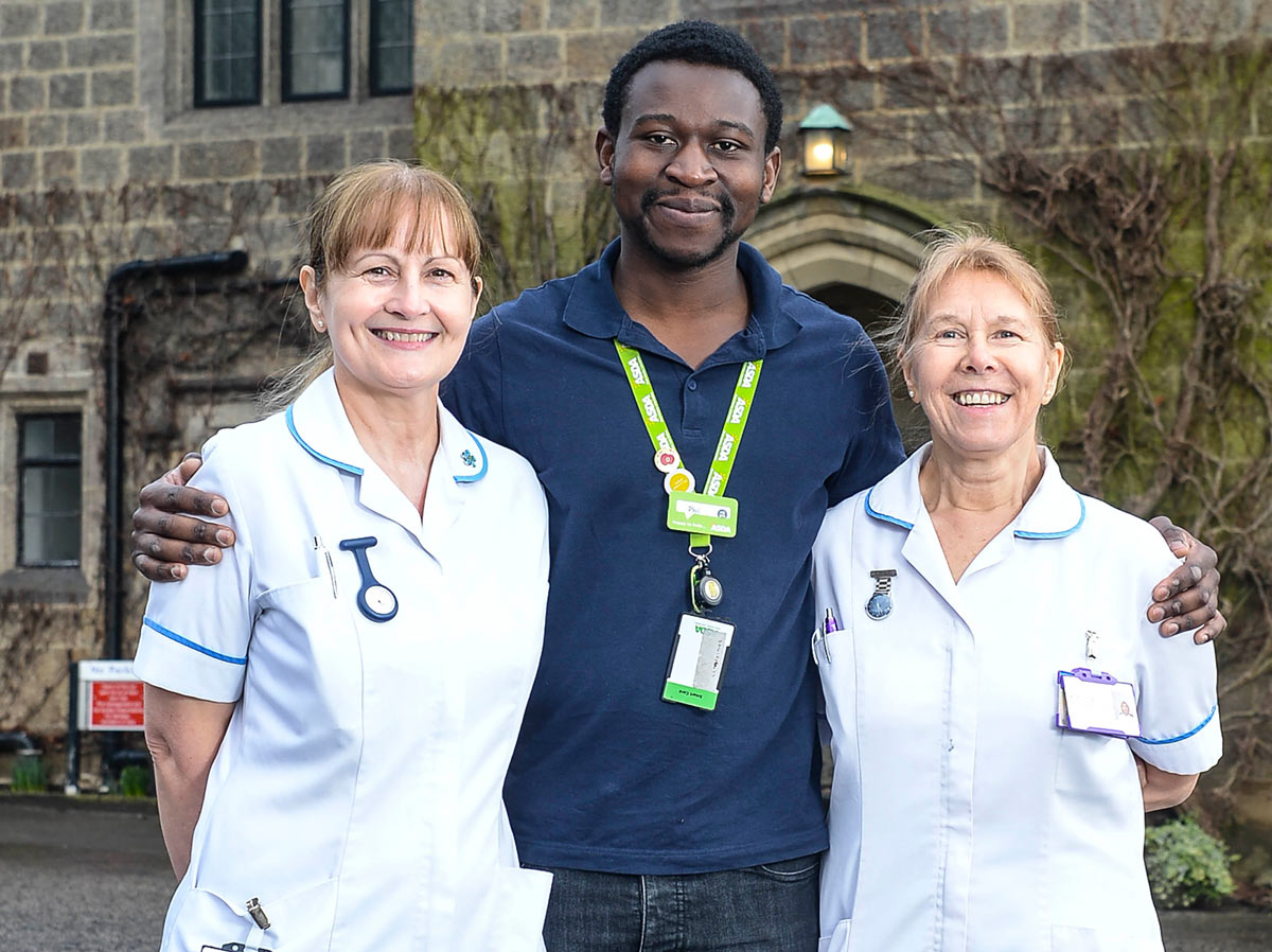 Asda's Phil Ngoma with two nurses from St Michael's hospice