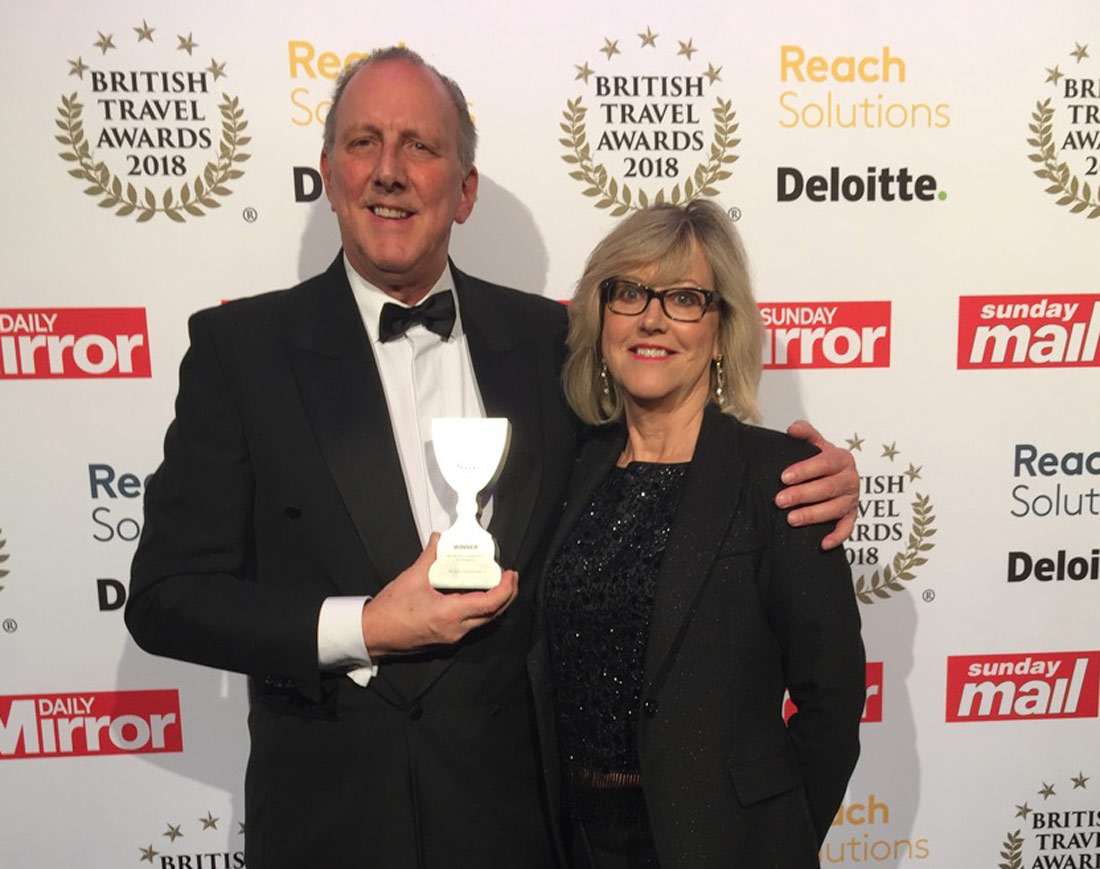Managing Director, Peter Cookson, along with his wife and fellow Director, Libby Cookson, accepting the award at The Battersea Evolution in London