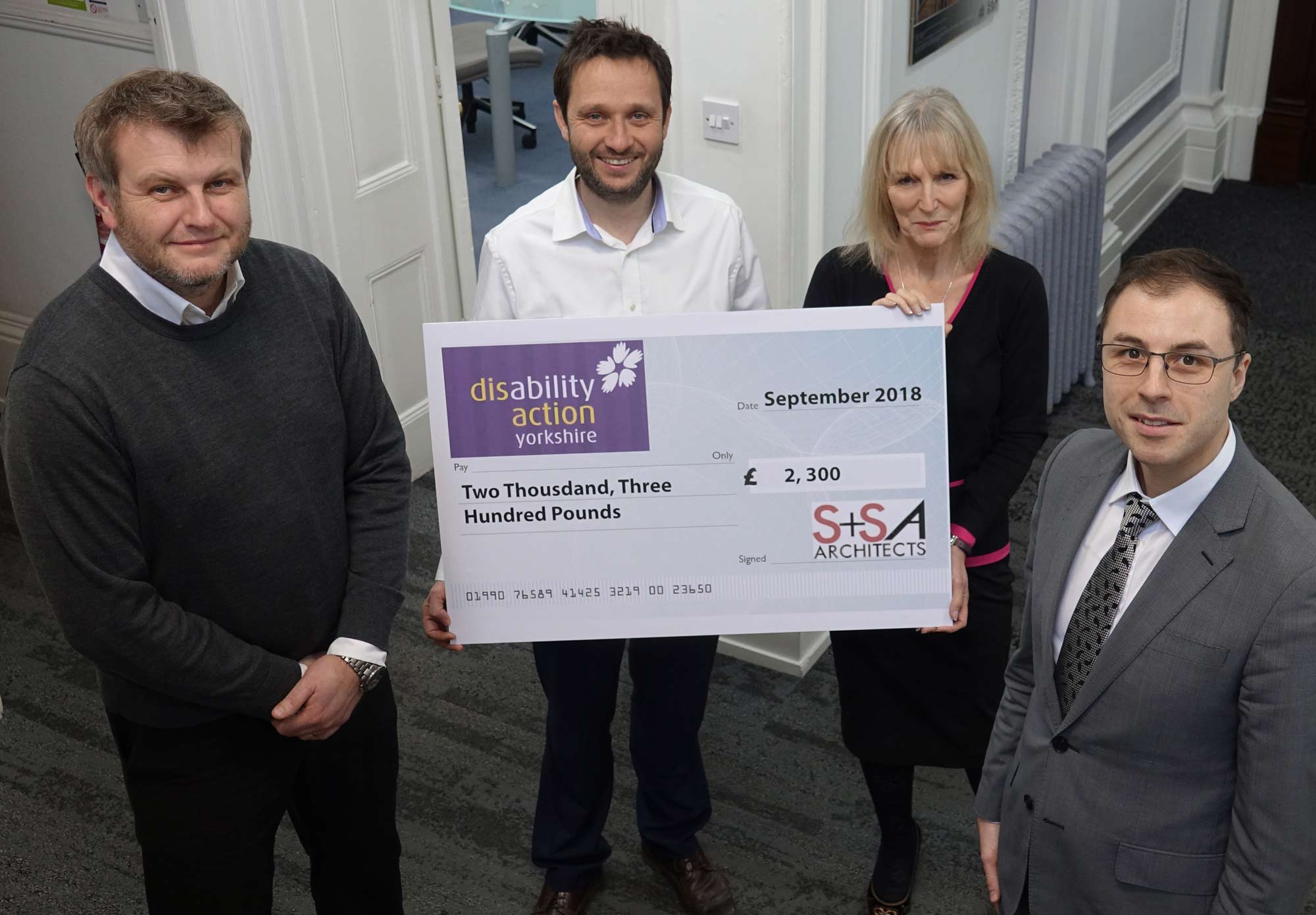 Pedal Power! Pictured from left are Jon Brookman and Joel Smith, both from S+SA Architects, and Disability Action Yorkshire’s chief executive, Jackie Snape and operations manager David Ashton-Jones