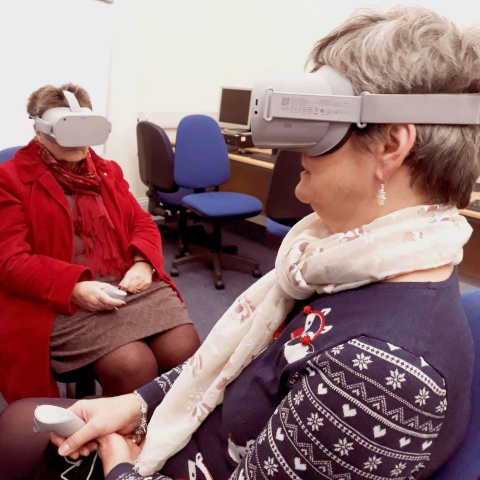 Two users at Harrogate Library try out the Virtual Reality headsets