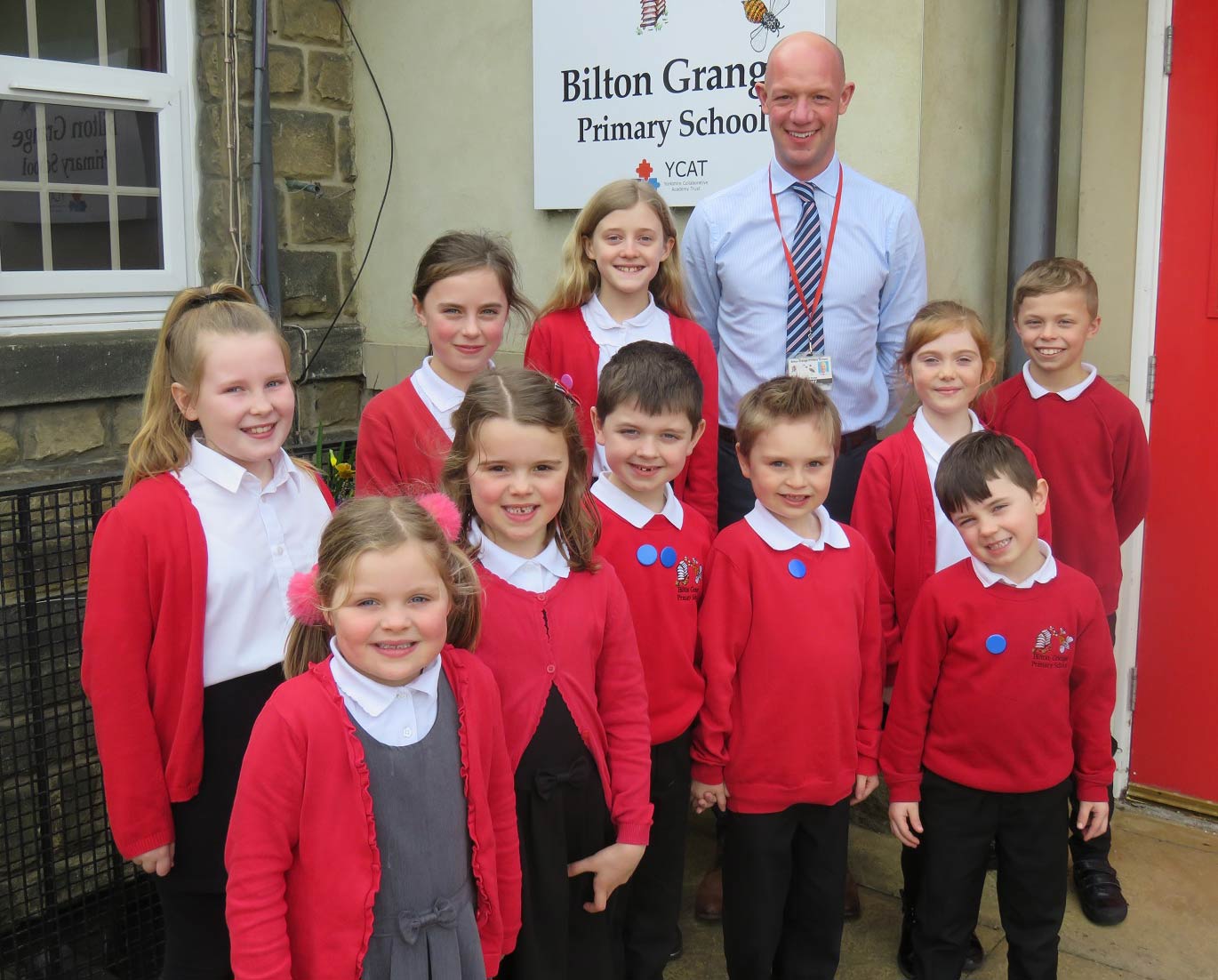 Deputy headteacher Richard Street with pupils from years 2 to 6 at Bilton Grange Primary School