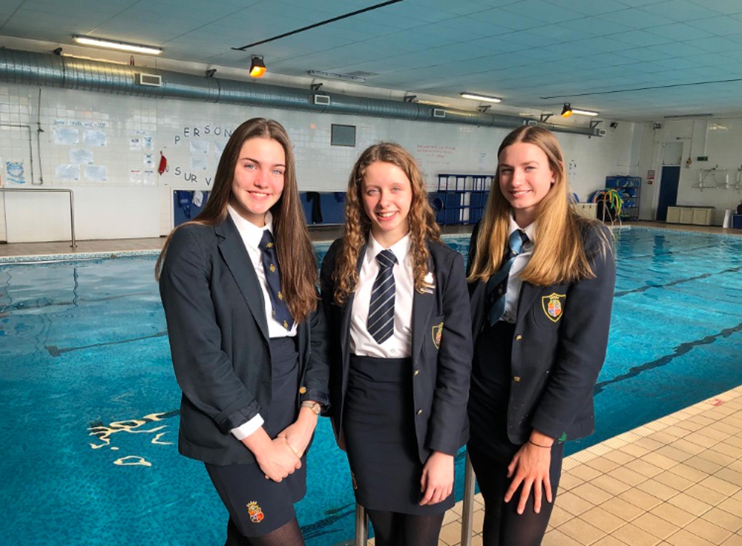 Swimming stars: (l-r) Anna, Christa and Imogen pictured beside the Ripon Grammar School swimming pool