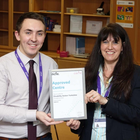 Training Excellence! Disability Action Senior Tutor Tom Brown and Training Operations Manager Denise Baynton with the award from NCFE