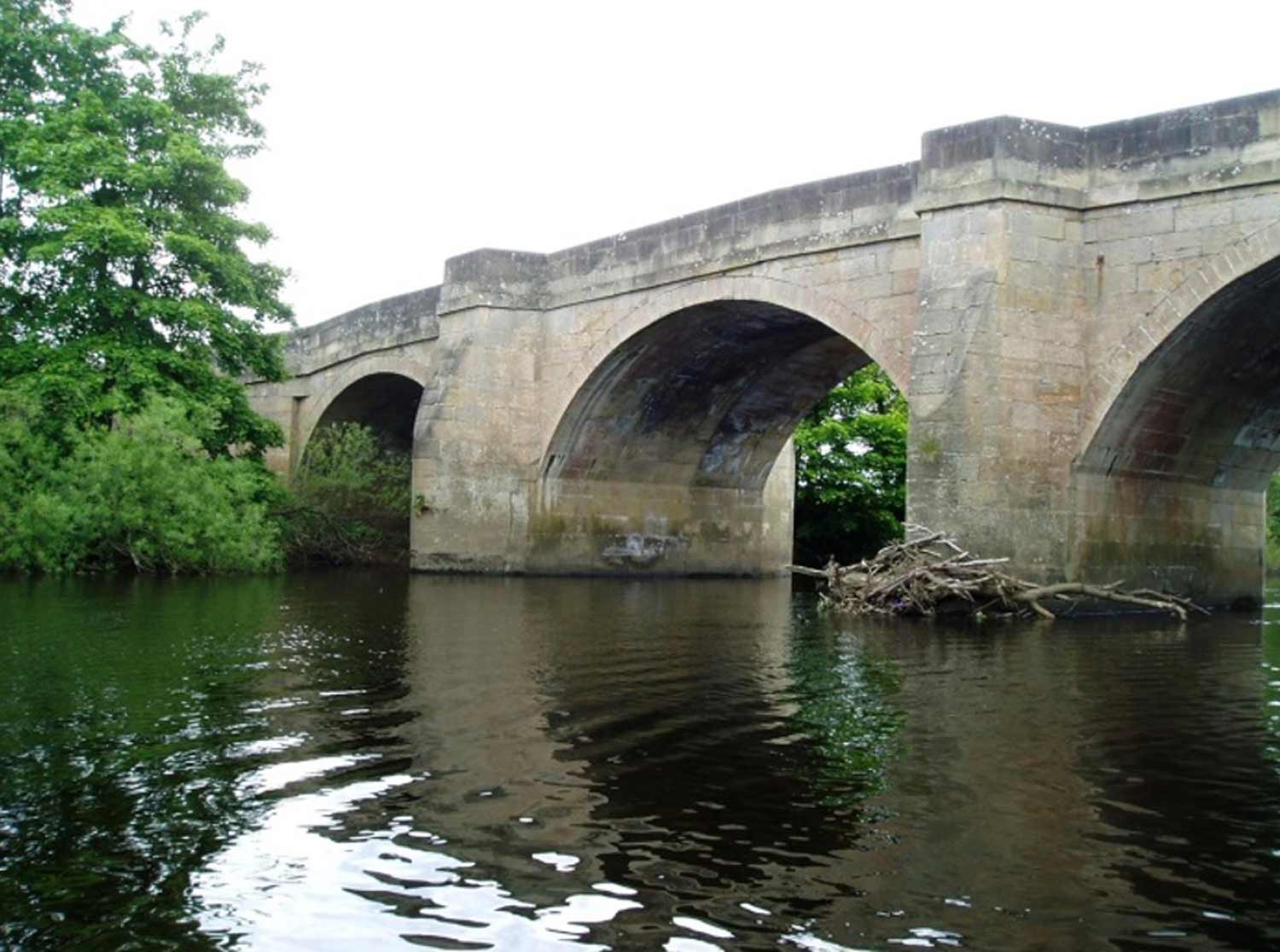 Grade II listed Masham Bridge spanning the River Ure.