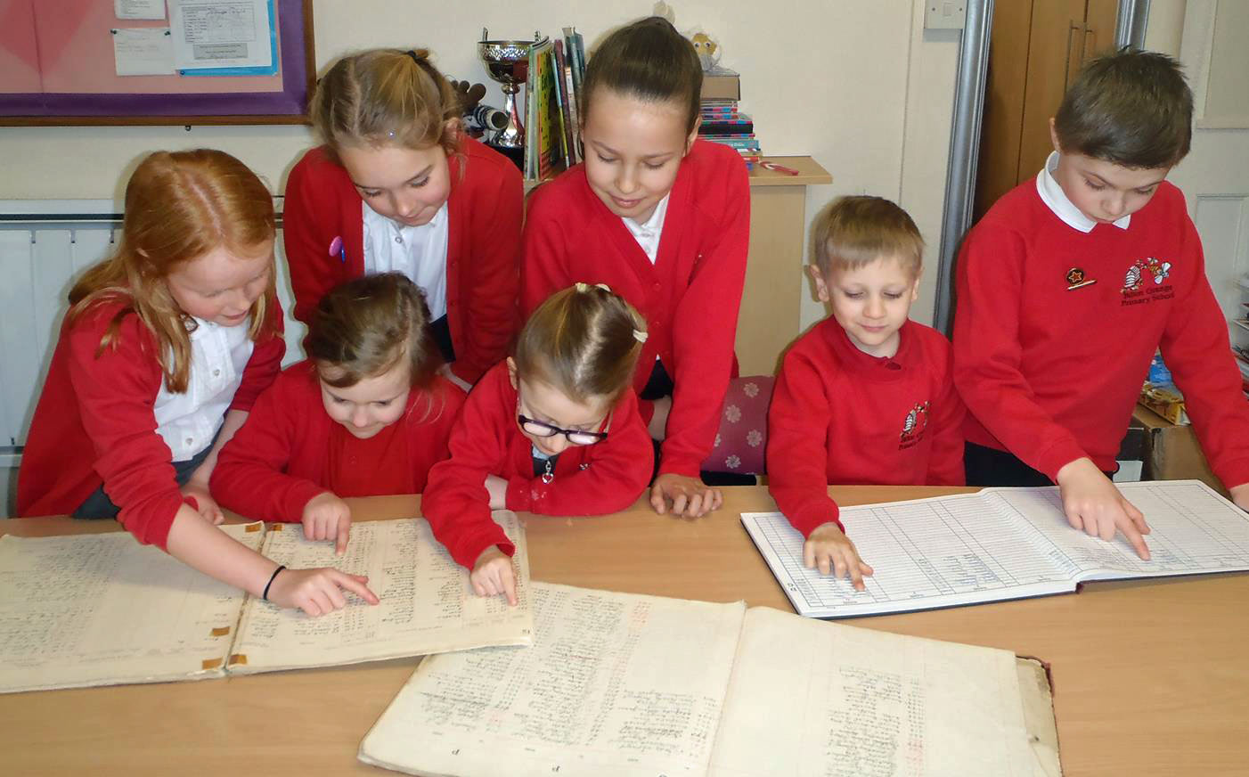 Pupils from Bilton Grange Primary School look at the original log books from 1919 as they prepare to celebrate the school’s centenary