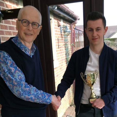 Cameron Osburn receiving his award from Kevin McAleese