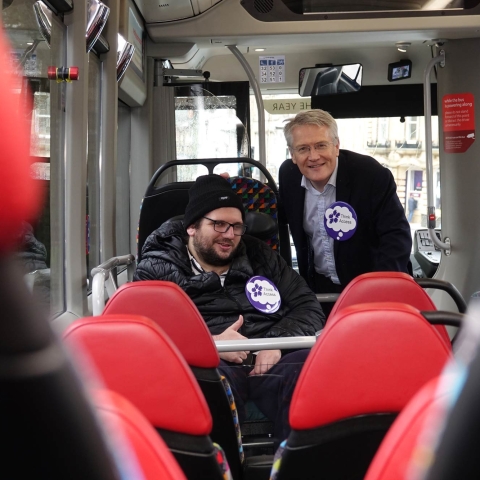 Disability Action Yorkshire customer Darren Asquith and MP Andrew Jones on board the new electric Transdev bus