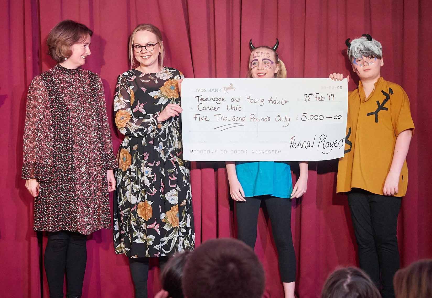 Pannal Players cast members present their donation of £5,000 to Sarah Horvath and Jess Stow from St James' Hospital, Leeds
