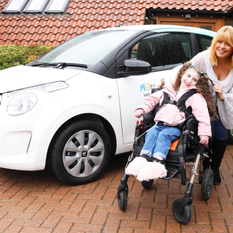 Christine Talbot launches the Martin House Grand Car Raffle with the help of Lacie-Lea Rennie