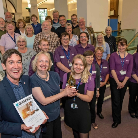 Benedicte Page presents the award to library supervisor Abigail Tanner with (left) Fraser Hutchinson of the Reading Agency, staff and volunteers from Harrogate library and local authors