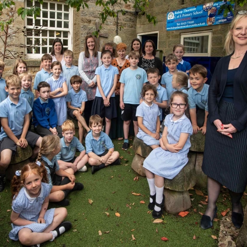 Liz Bedford, headteacher (right) with children and staff from Bishop Thornton Church of England Primary School