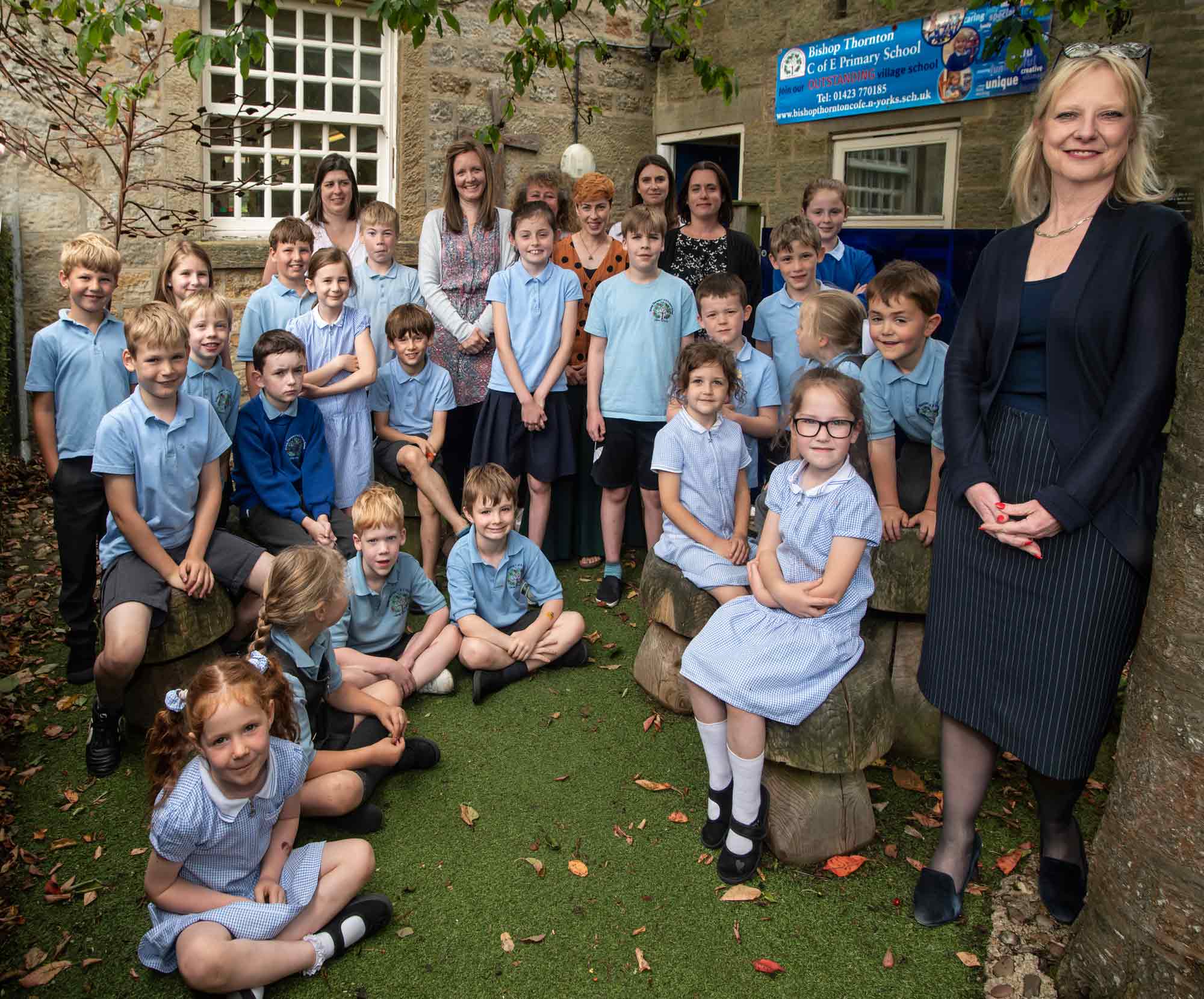 Liz Bedford, headteacher (right) with children and staff from Bishop Thornton Church of England Primary School