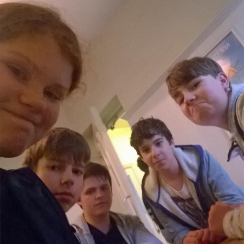 Beth Thurlow, left, and her friends making silly faces after arriving at the youth hostel