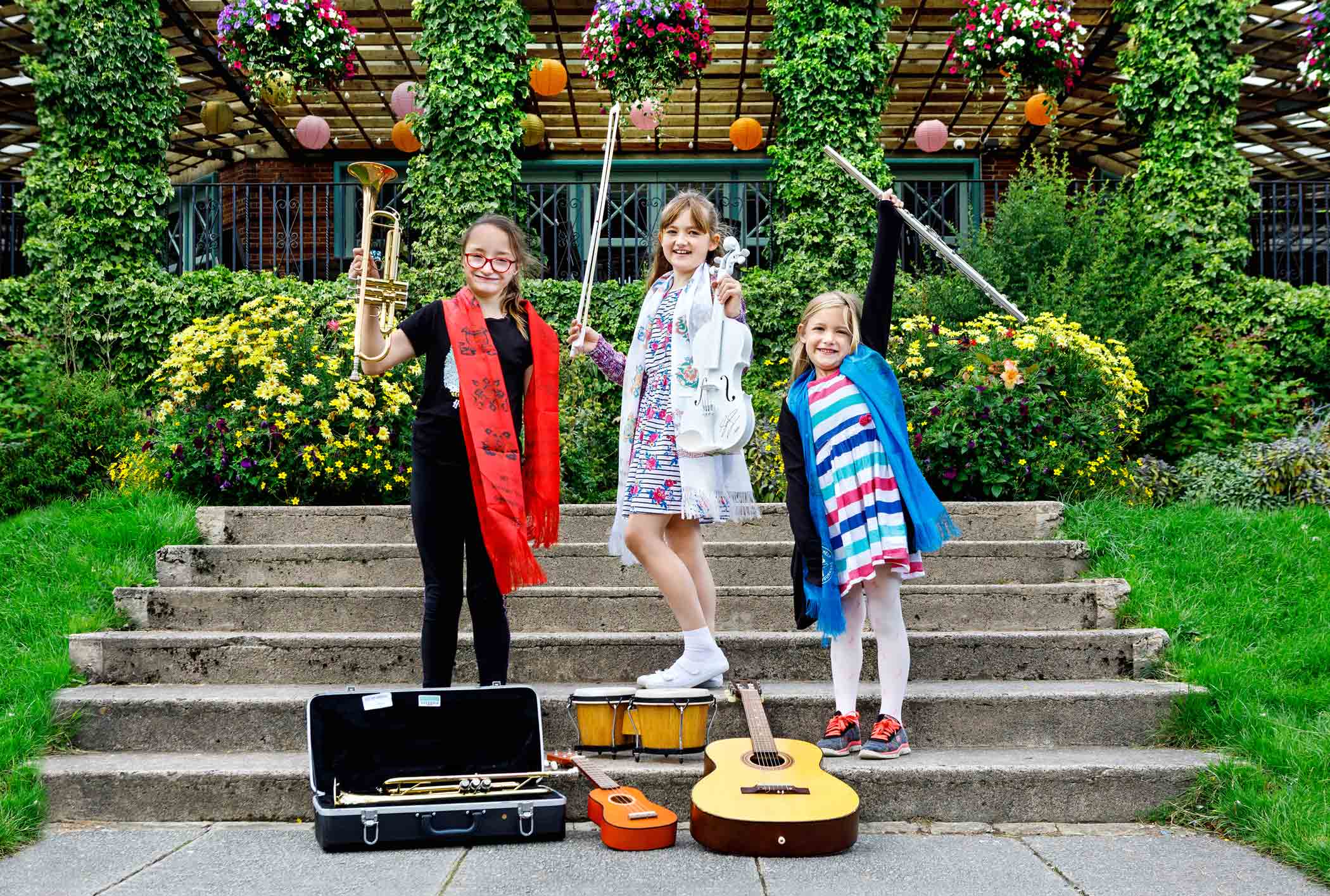 Local children in Harrogate’s Valley Gardens with Sam Smith’s violin and a selection of other instruments from the Ronnie Scott Foundation’s 2019 amnesty. Left to right: Mercedes Wilson, Jessica Hepworth, Sophie Hepworth