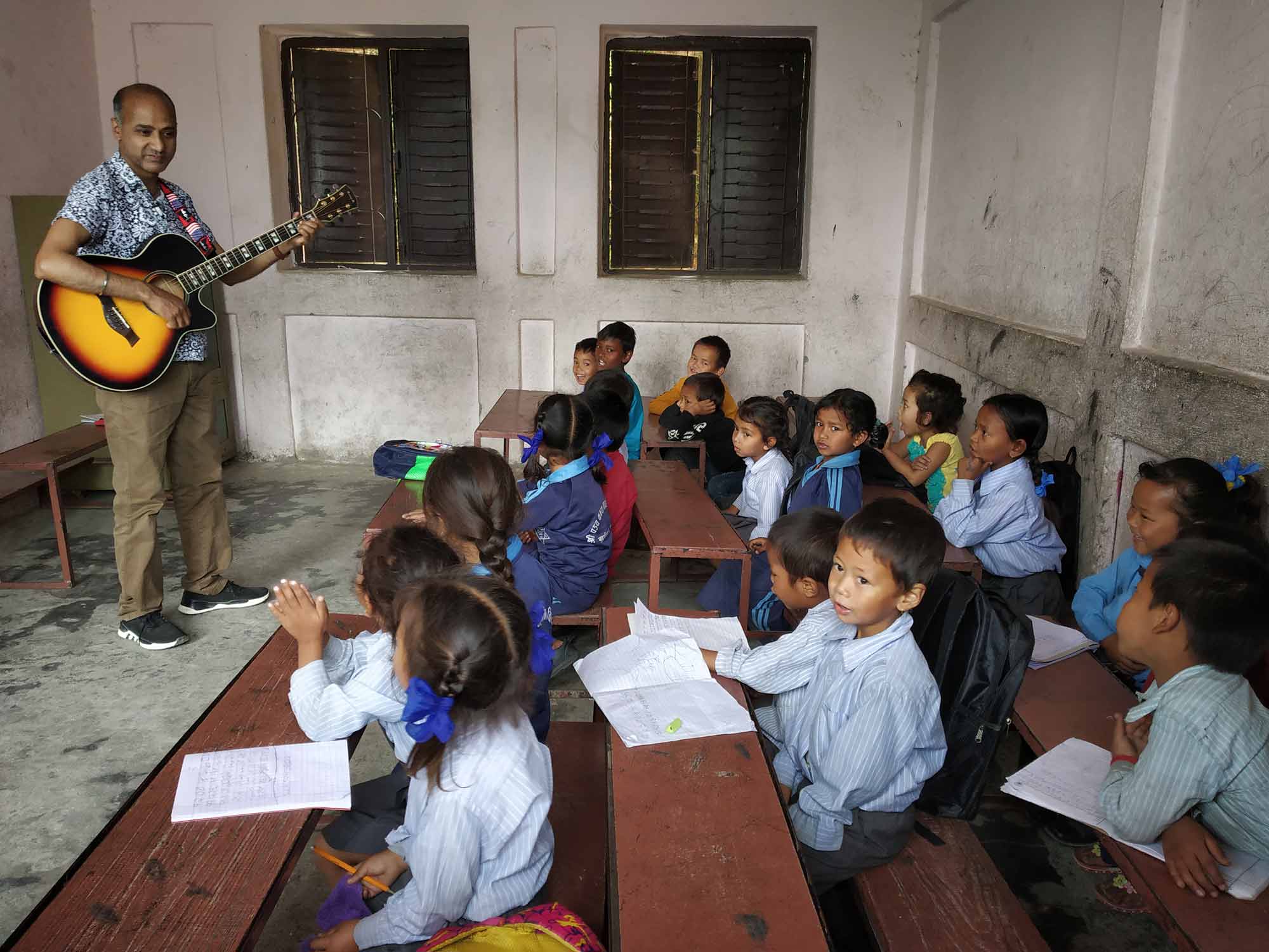 Sumit Pokhrel teaching music in Nepal