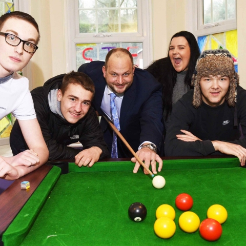 James Cliffe, group manager, with young people in No Wrong Door