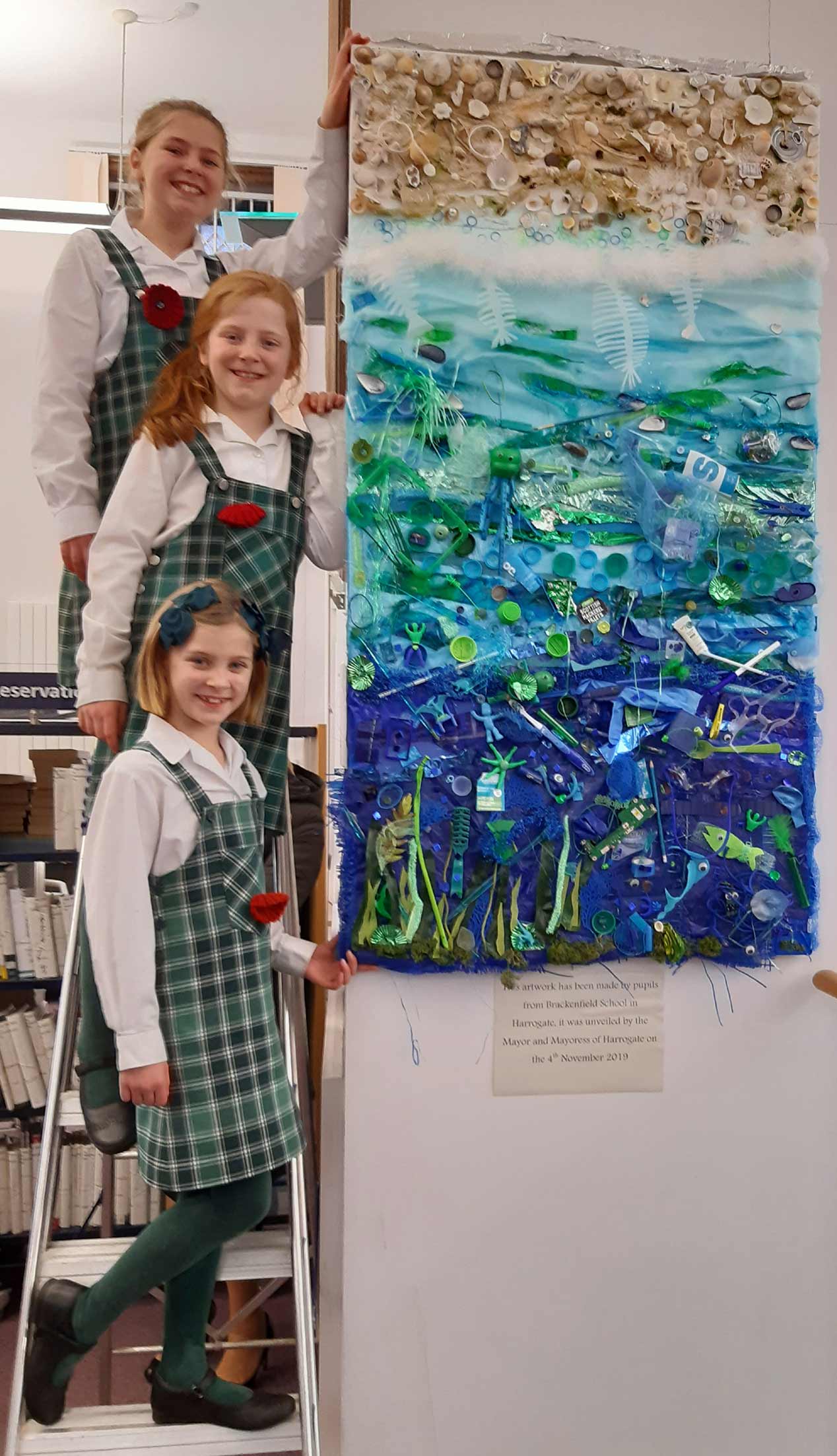 sisters Beatrice, Eliza and Theadora Haddow with their art in Harrogate library