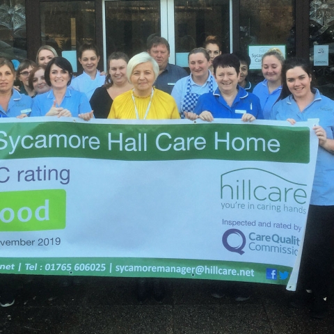 Staff at Sycamore Hall Care Home celebrate their “Good” rating from regularly the Care Quality Commission