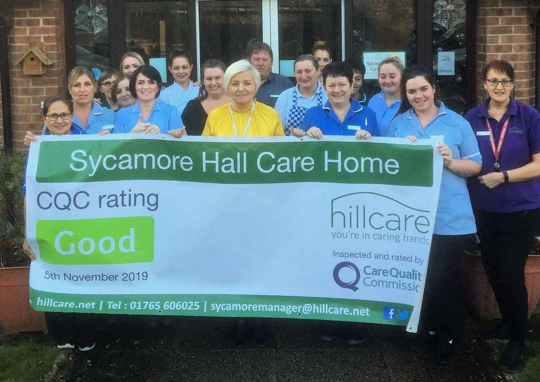 Staff at Sycamore Hall Care Home celebrate their “Good” rating from regularly the Care Quality Commission