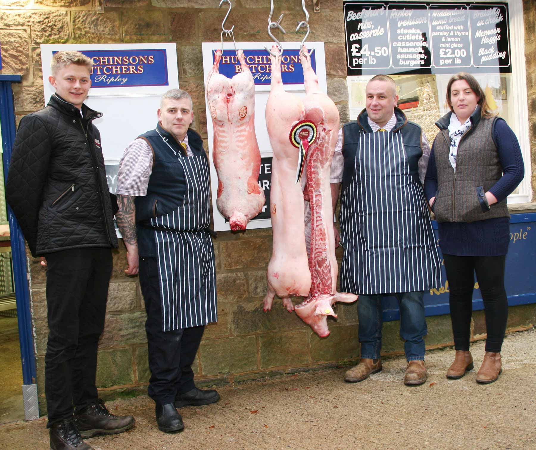 Pictured at Hutchinsons Butchers with some of the prize-winning prime meat purchased for customers Christmas’ tables at Skipton Auction Mart are, from left, the mart’s junior auctioneer Kyle Hawksworth, who sold the pigs, Hutchinsons head butcher Brian Robinson, Dave Kirby and Alison Kay. If using pics, please credit Moule Media, Skipton