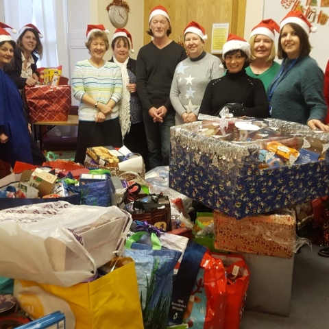 Carers' Resource staff with gifts at Harrogate office