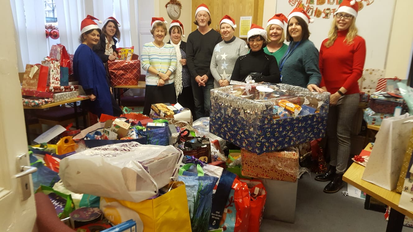 Carers' Resource staff with gifts at Harrogate office