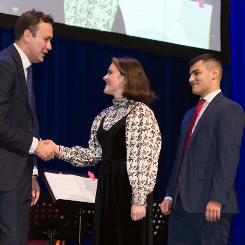 Headteacher, Neil Renton, presenting awards to Head Students, Phoebe Kyriakopoulos and Joe Nichols