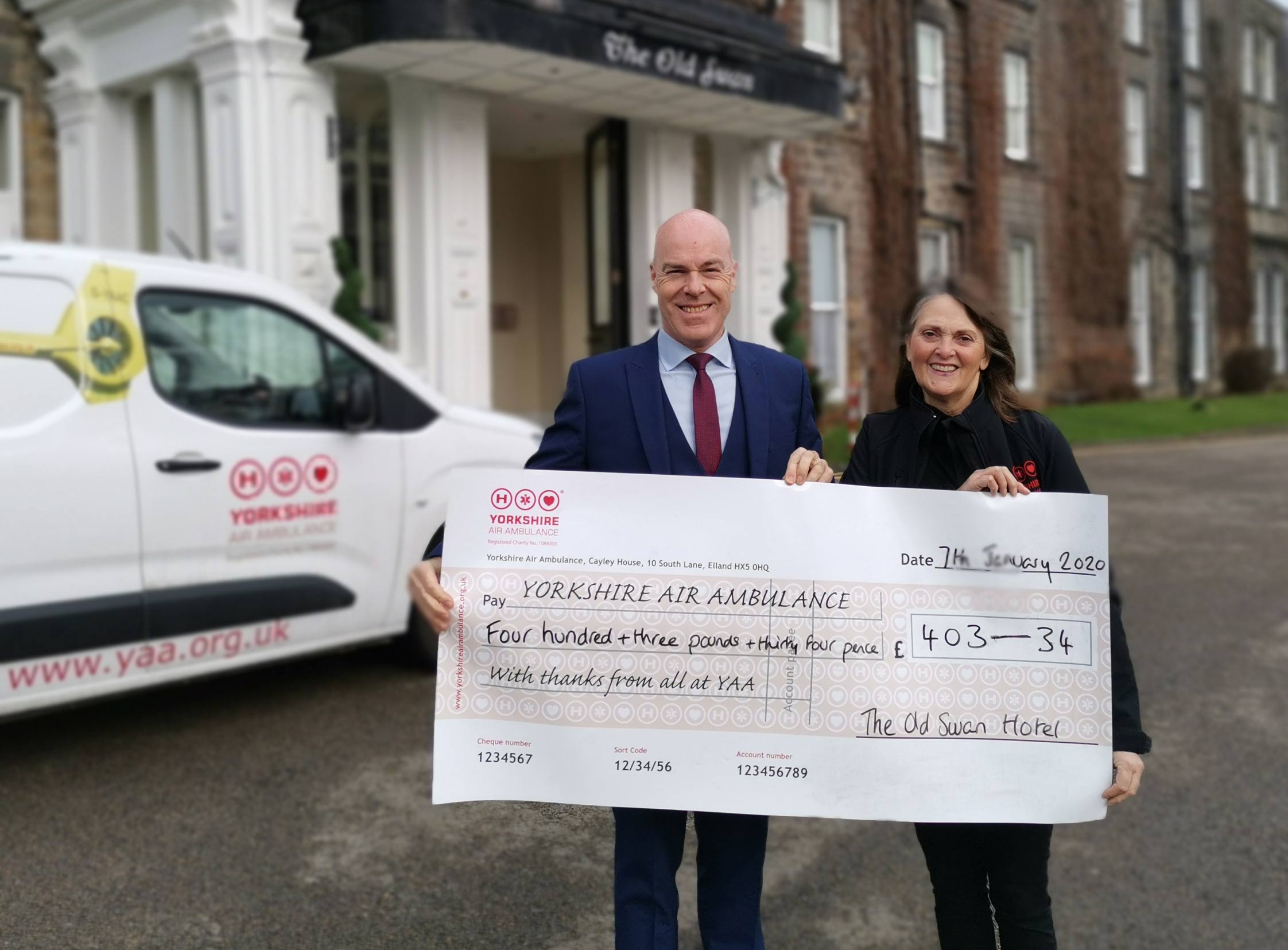 David Ritson, General Manager at The Old Swan, presents the cheque to Linda Stead, Fundraise for the North at the Yorkshire Air Ambulance