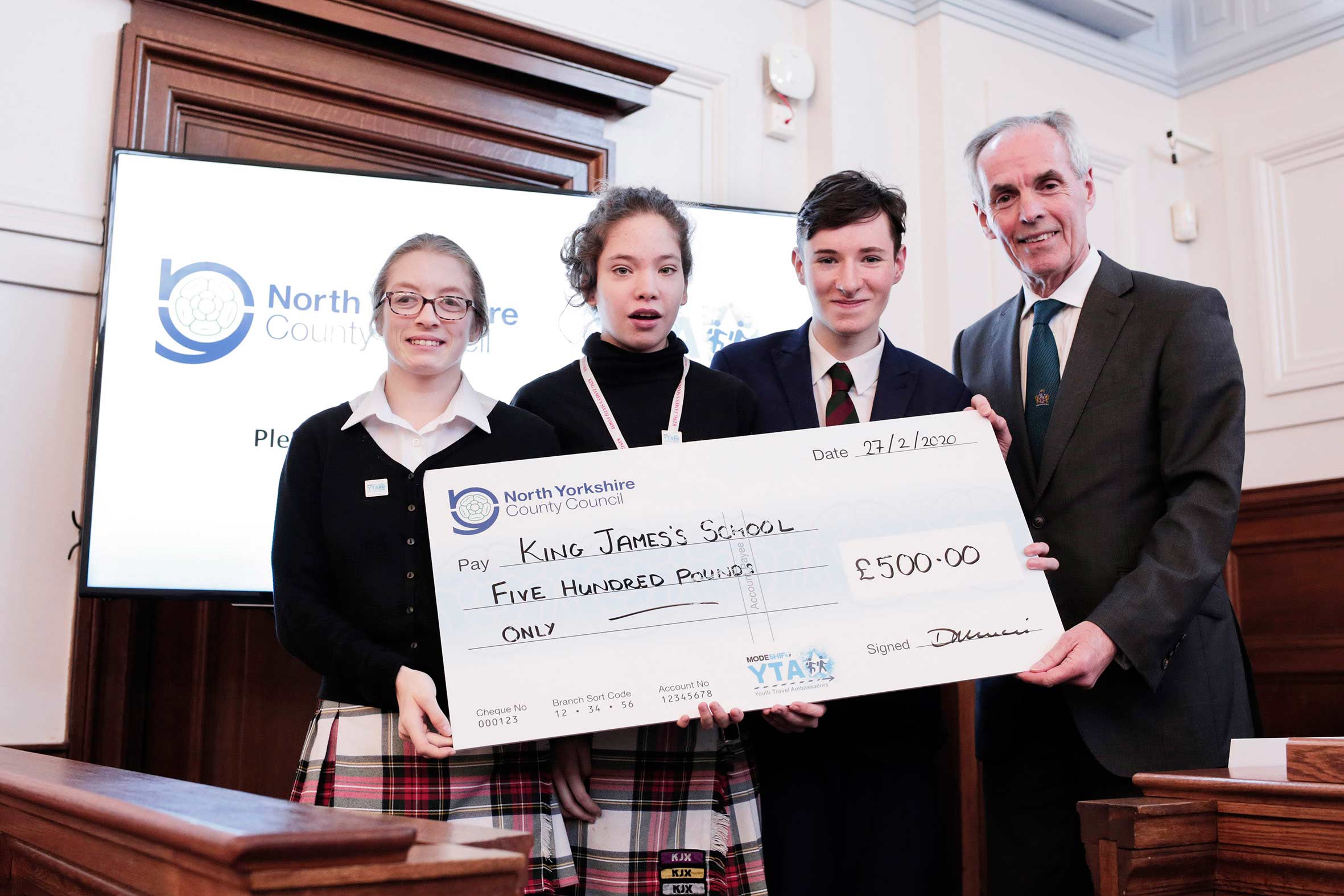 King James's School pupils Sarah Woodlands-Mooney, Sam Morris and Brandon Hancock receiving their cheque from Cllr Don Mackenzie