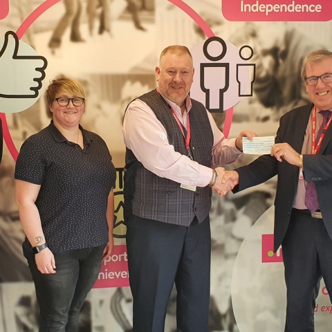 Presenting and receiving the grant are, from left, Barclays Branch Manager and long-term supporter of both charities Adam Moore, Assistive Technology Assistant at Henshaws Amanda Martin, Henshaws Specialist College Principal Adrian Sugden, Yorkshire Young Achievers Foundation Trustee Martin Gerrard and Henshaws Mis Manager Luke Lengiewicz