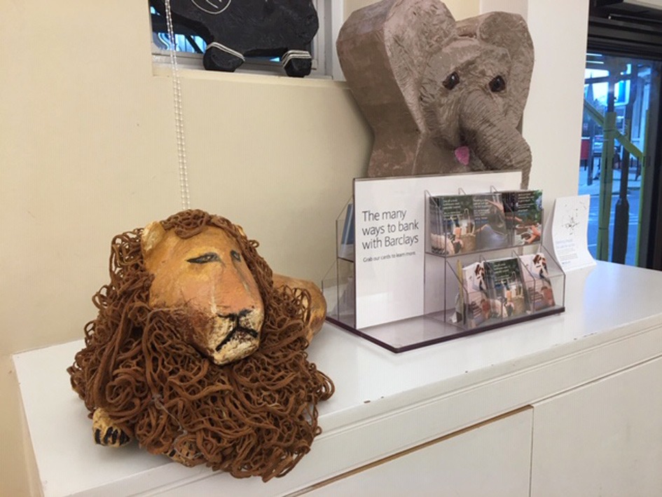 A lion and elephant are on display