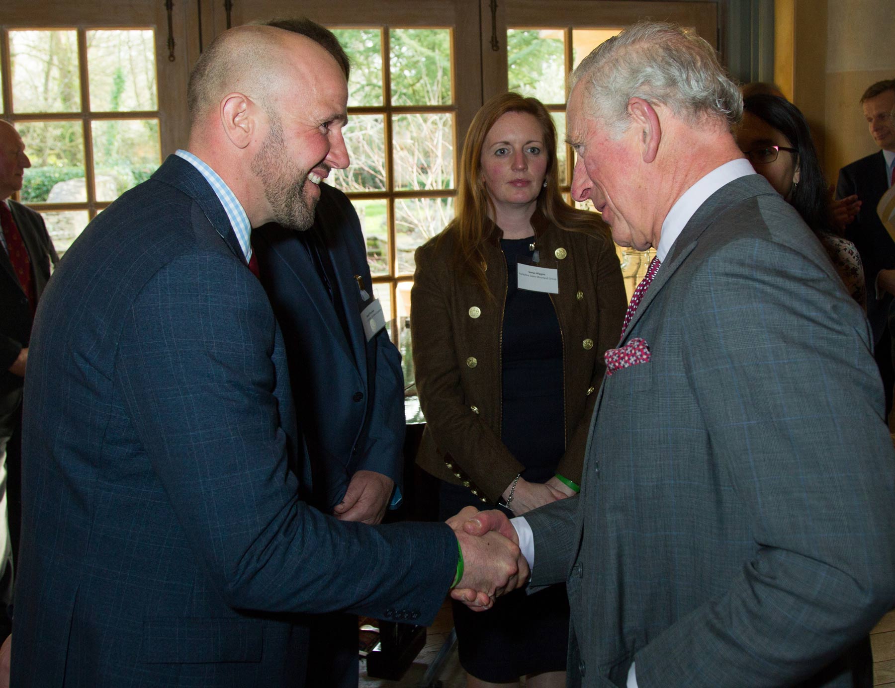 Gamekeeper Ian Sleightholm shaking the hand of HRH The Prince of Wales, Prince Charles with Sonya Wiggins in the background