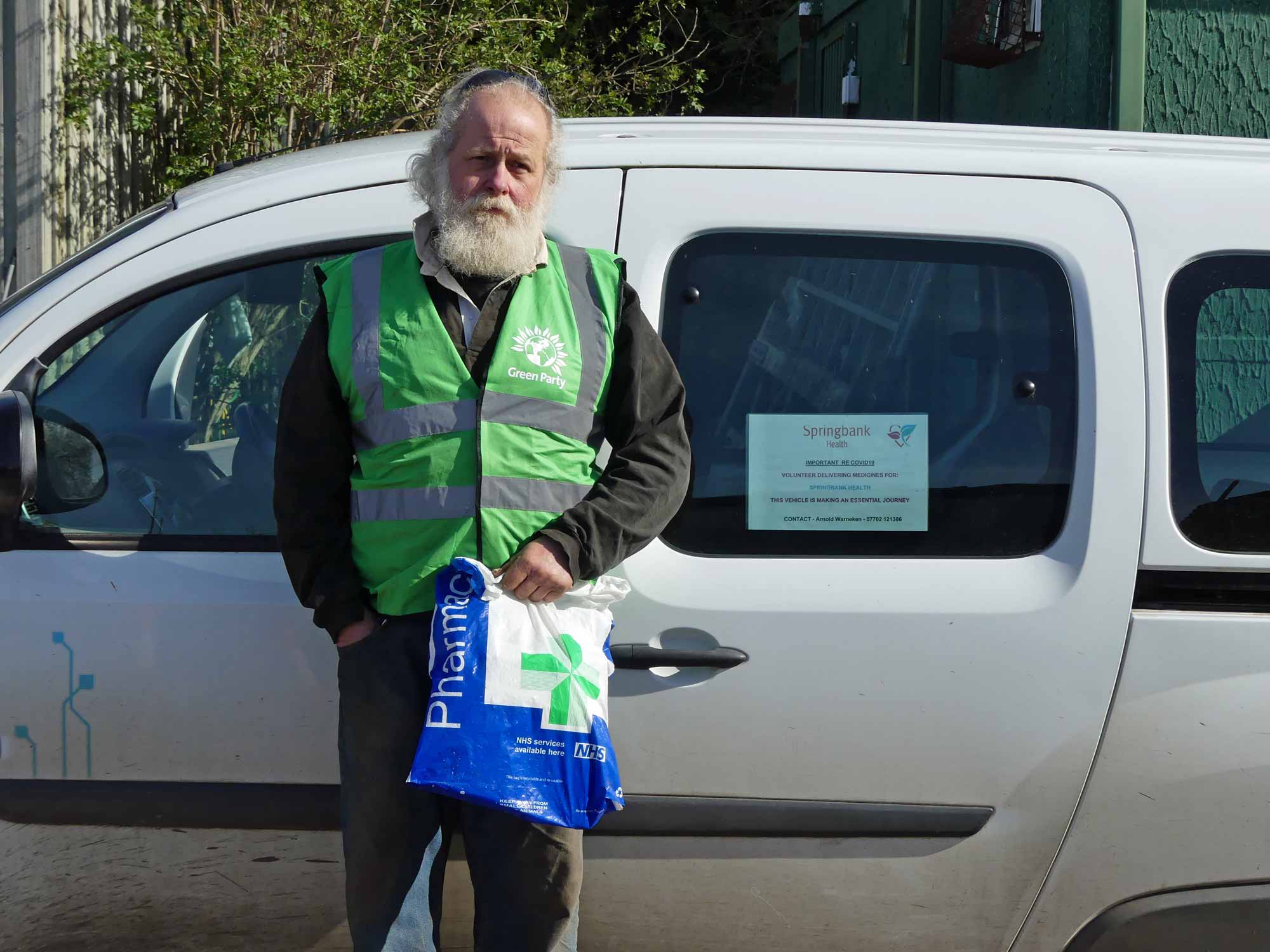 Arnold Warneken, Green Campaigner for the Ainsty, preparing to deliver medicines to local patients in his fully-electric van