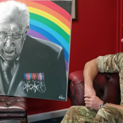 Lt. Col. Rich Hall admires the portrait after the presentation