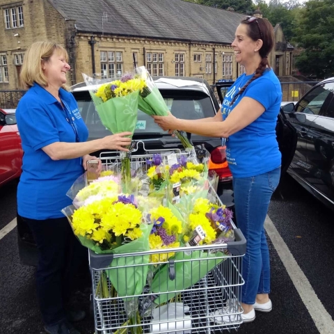 Carers’ Resource locality workers Kay Nichols and Sarah Wademan with their flower deliveries