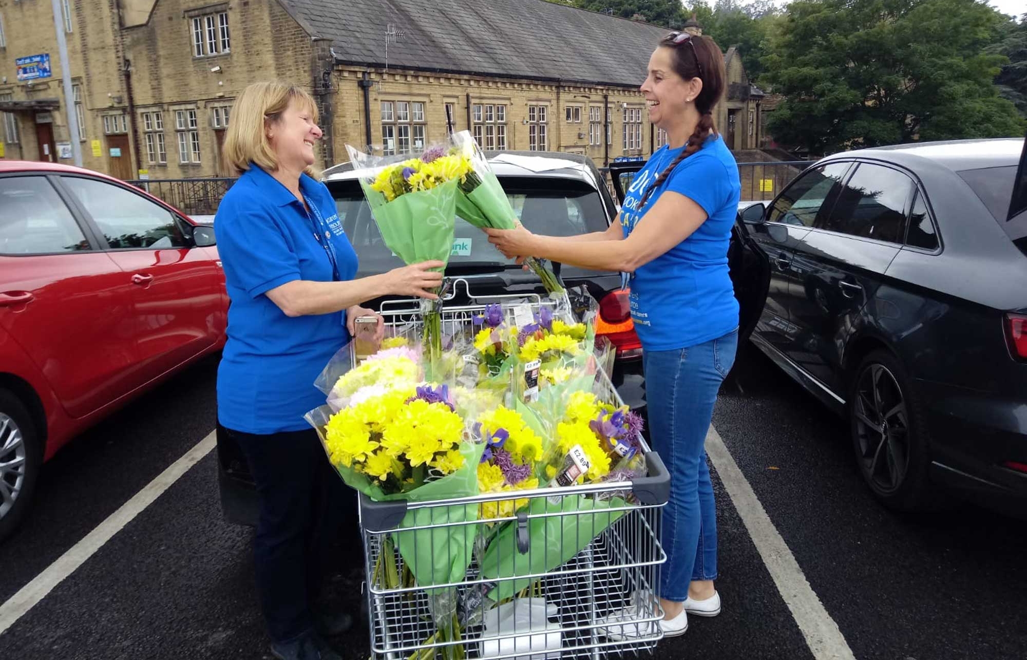Carers’ Resource locality workers Kay Nichols and Sarah Wademan with their flower deliveries