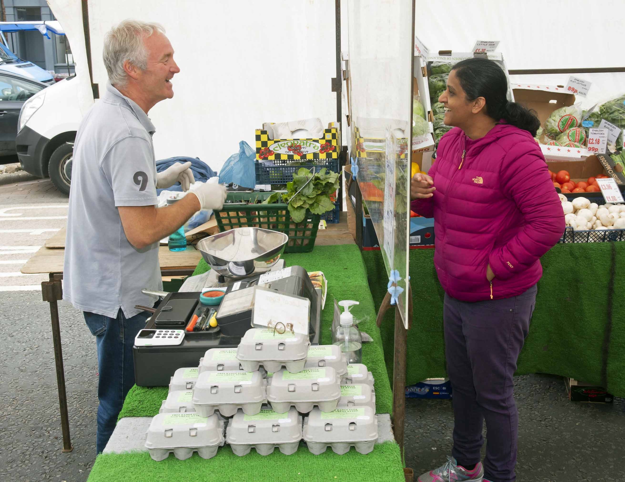 Paul Beswick, of Beswick’s Fruit and Veg, serving a customer