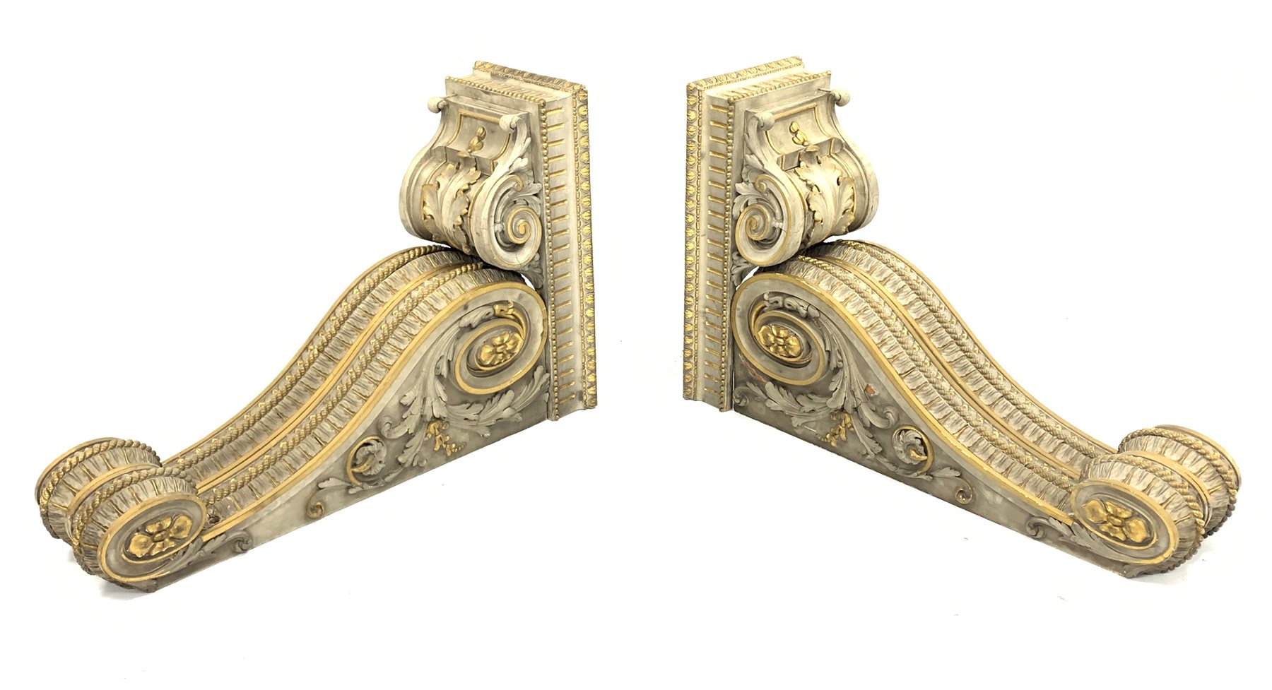 Pair of early Victorian parcel-gilt and white painted architectural brackets
