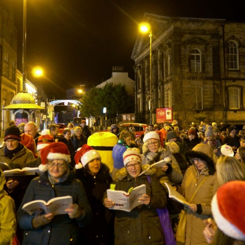 Reincantation Choir preparing to lead the Harrogate at Christmas Lantern Parade from Wesley Church last year