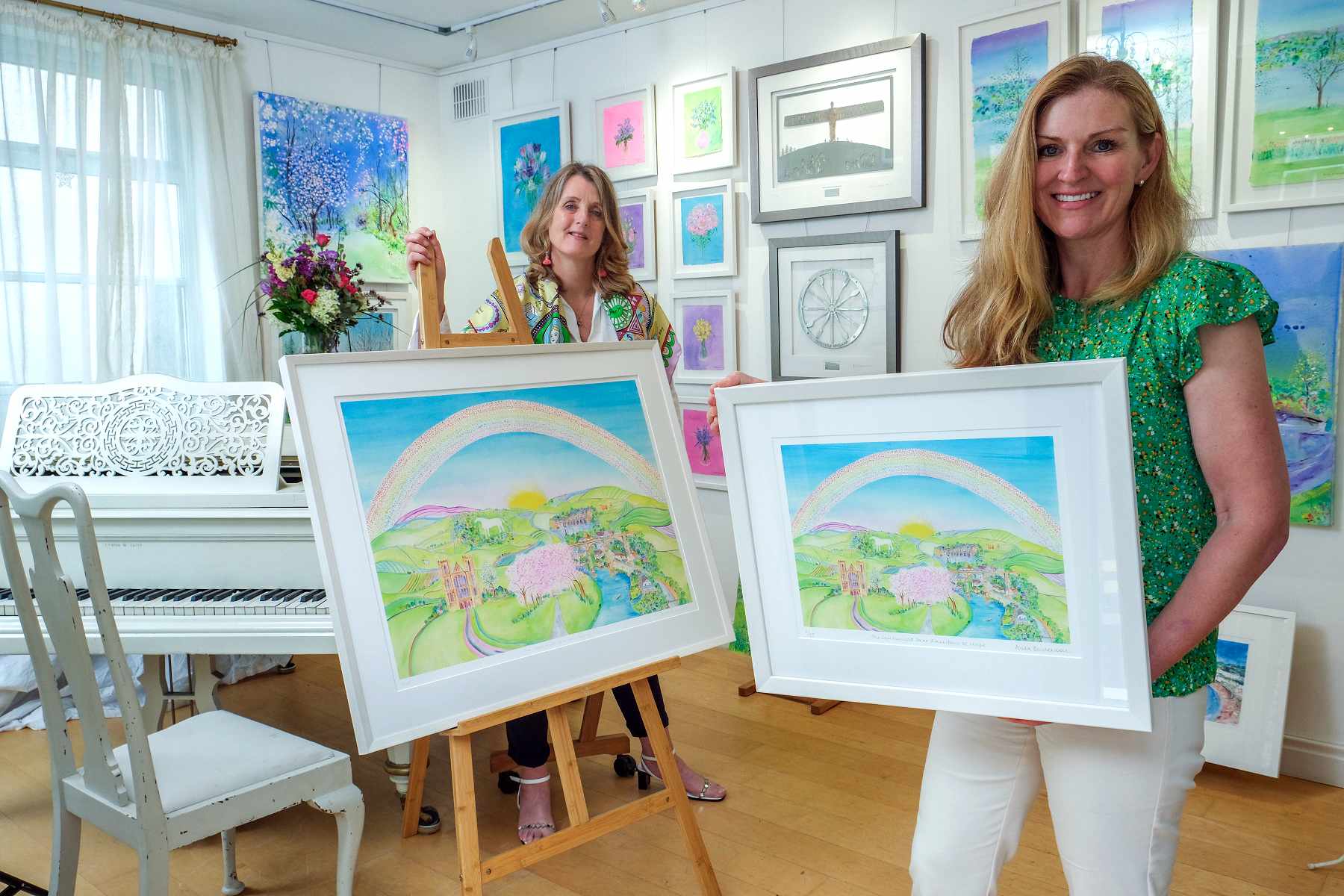 Artist Anita Bowerman, left, and Continued Care’s director Samantha Harrison at The Dove Tree Art Gallery and Studio in Harrogate with the ‘Rainbow of Hope’ painting