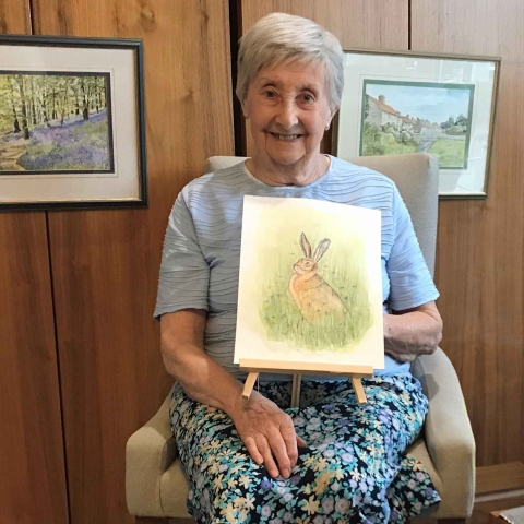 Brenda Raynes, from Anchor’s The Manor House, with her paintings, some of which have been selected for an online gallery to mark National Day of Arts in Care Homes