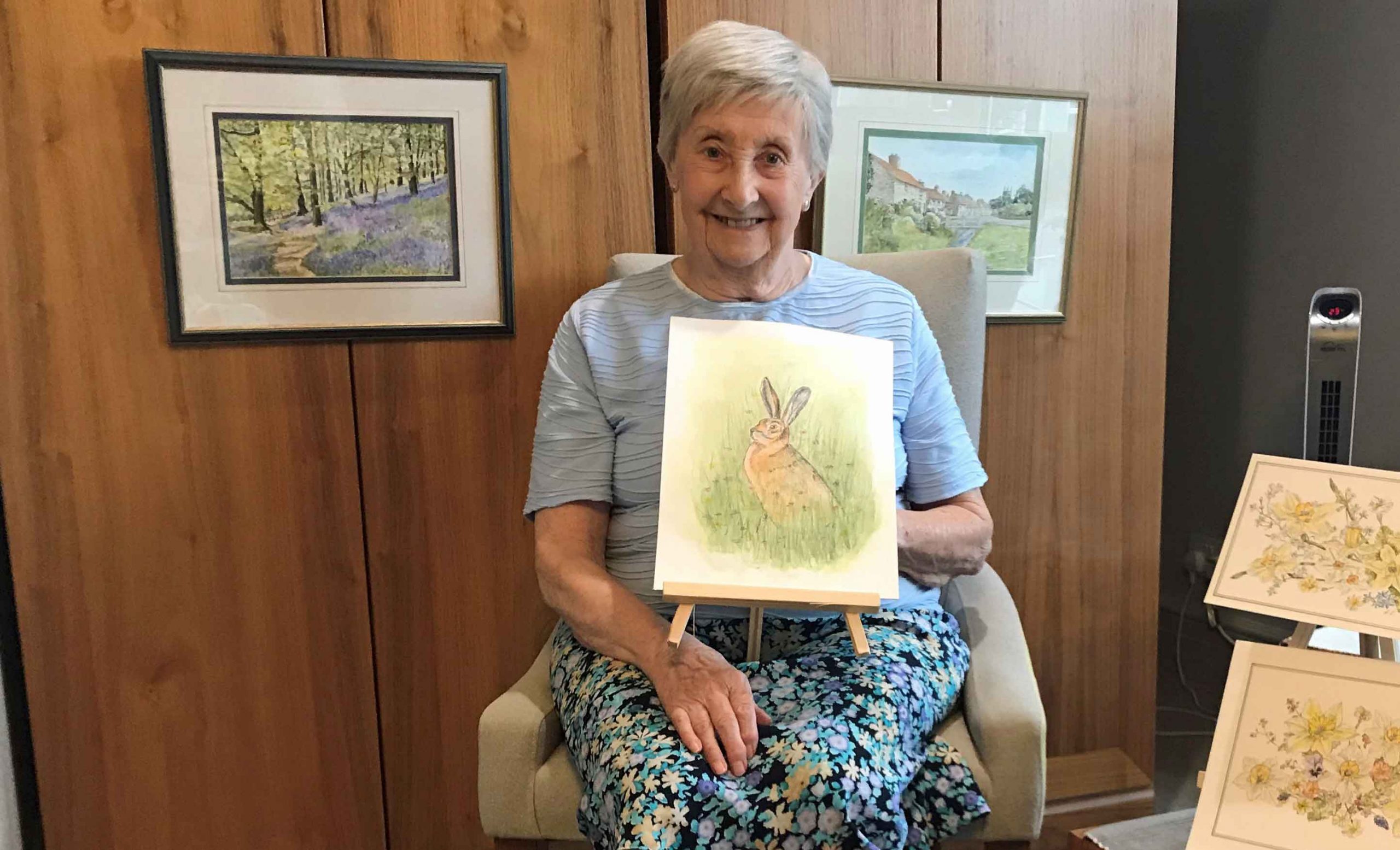 Brenda Raynes, from Anchor’s The Manor House, with her paintings, some of which have been selected for an online gallery to mark National Day of Arts in Care Homes