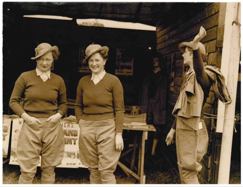 Winifred (left) and her sister Dorothy (centre) at a Women’s Land Army recruitment stand. (Image courtesy of the Yorkshire Museum of Farming)