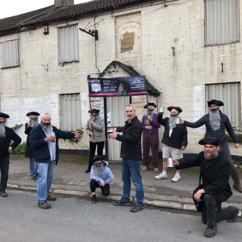 Pub Champion” Greg Mulholland (centre), of Campaign for Pubs, with Dave Robinson and supporters of the Henry Jenkins Community Pub initiative outside the Henry Jenkins, Kirkby Malzeard