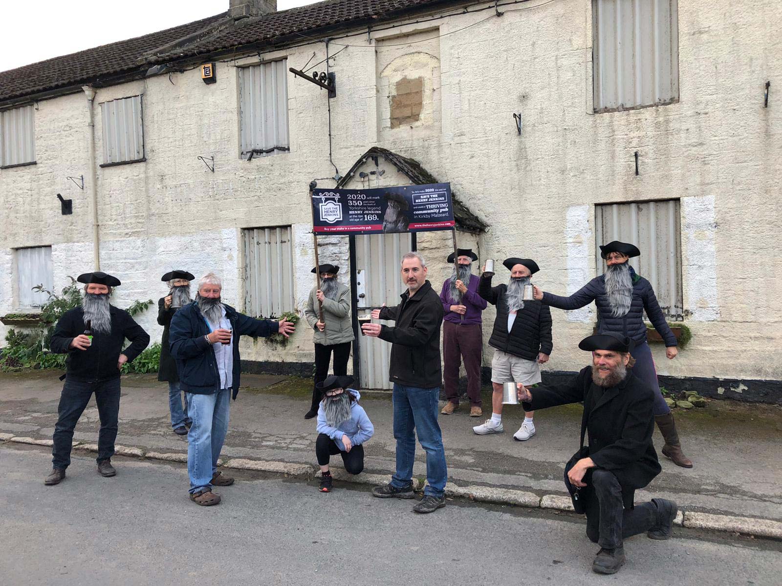 Pub Champion” Greg Mulholland (centre), of Campaign for Pubs, with Dave Robinson and supporters of the Henry Jenkins Community Pub initiative outside the Henry Jenkins, Kirkby Malzeard