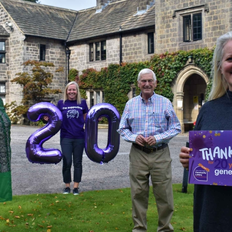 Super supporters Maureen Burns and Richard Toole receive a socially distanced thank you from members of the Saint Michael’s team, including Deputy Chief Executive Tina Hedges (far right)