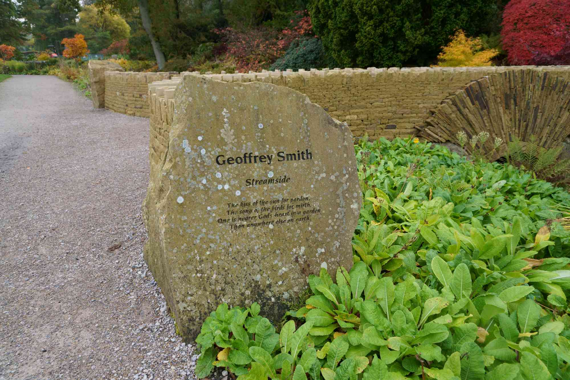 The Geoffrey Smith memorial stone is positioned at one end of the bridge wall as a lasting testament to a much-loved former garden curator