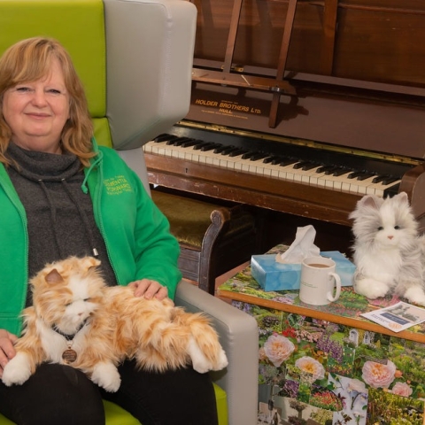 Jill Quinn, CEO of Dementia Forward with the robotic cats
