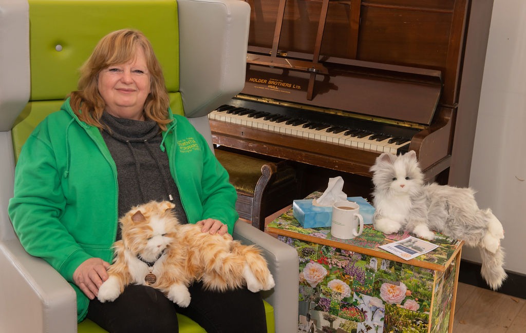 Jill Quinn, CEO of Dementia Forward with the robotic cats